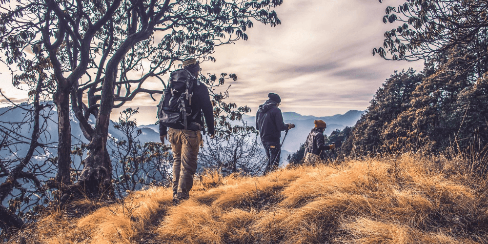 group go people with backpacks hiking