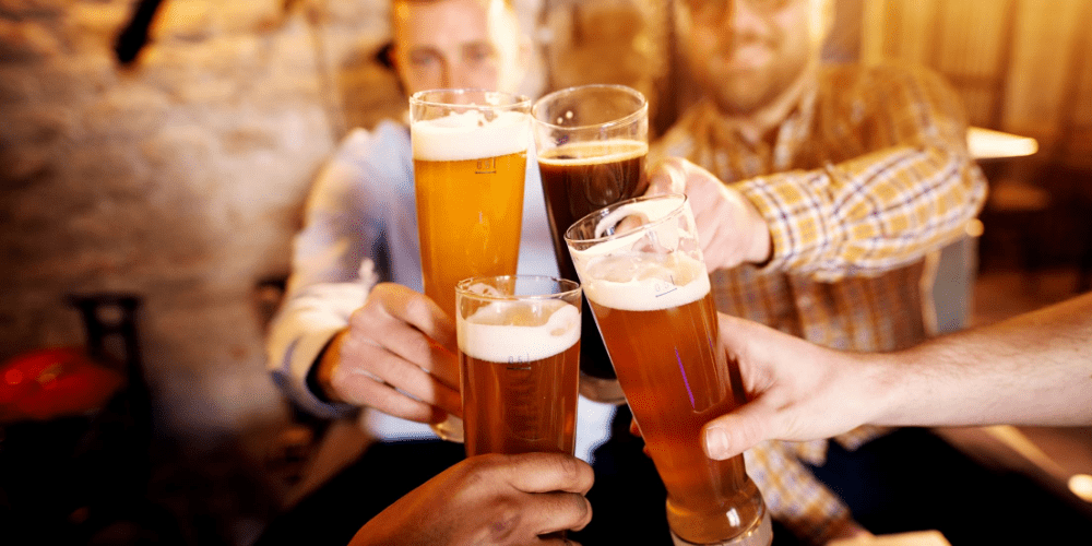 people toasting with beer