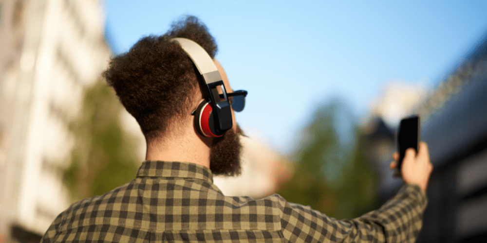 man in his headphones taking selfie