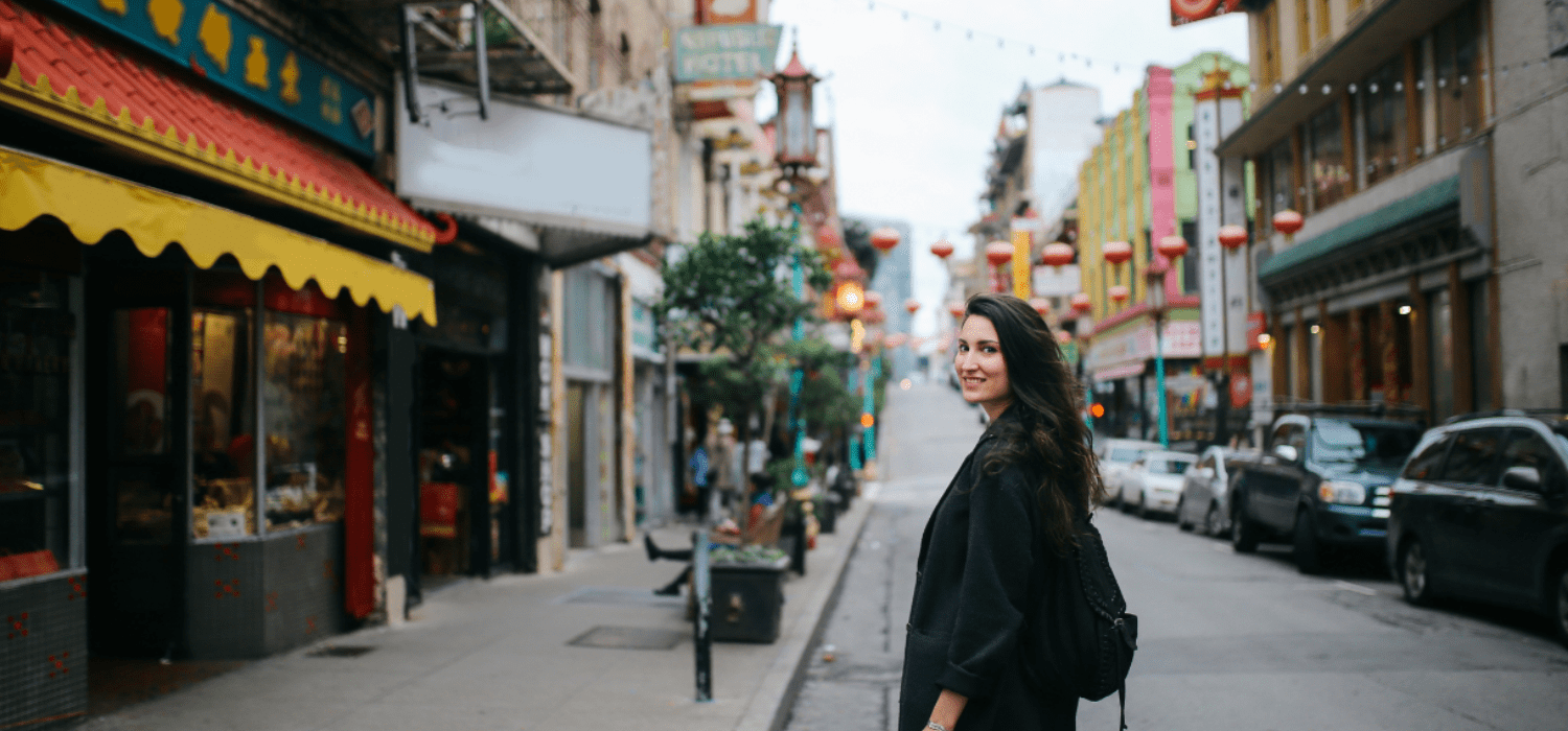 brunette girl standing on the street of Chinatown