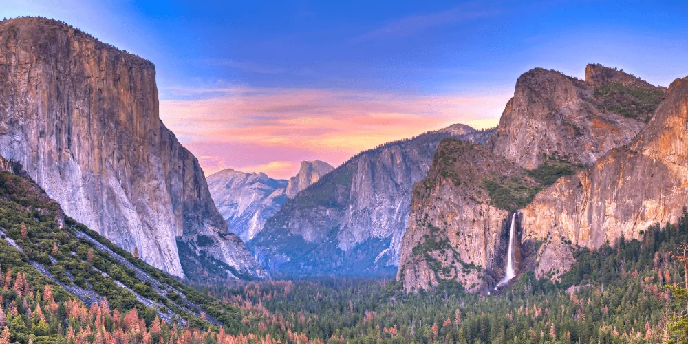 beautiful view of Yosemite valley during sunset with cotton candy skies