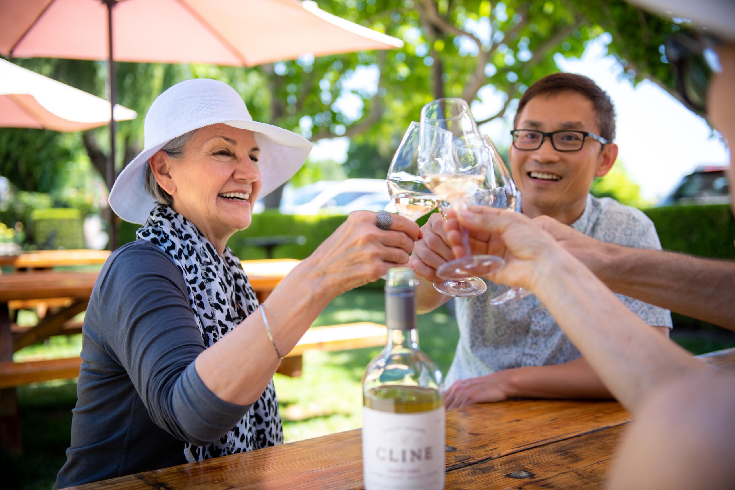 a couple drinking wine at a table