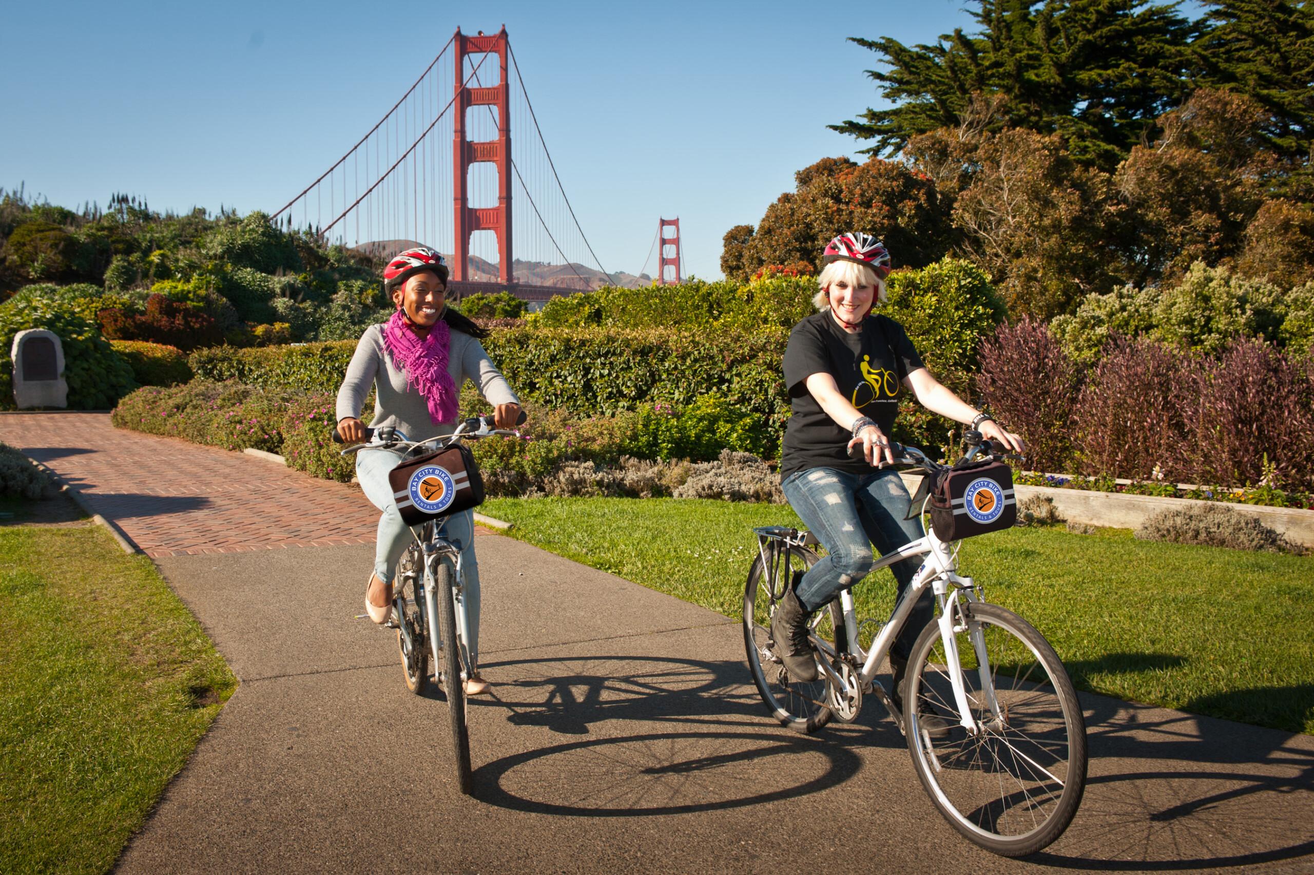 two girl riding bikes