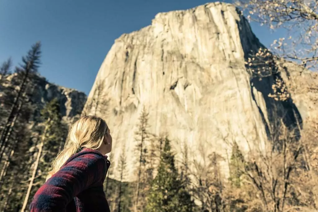 blonde woman looking at el capitan in yosemite