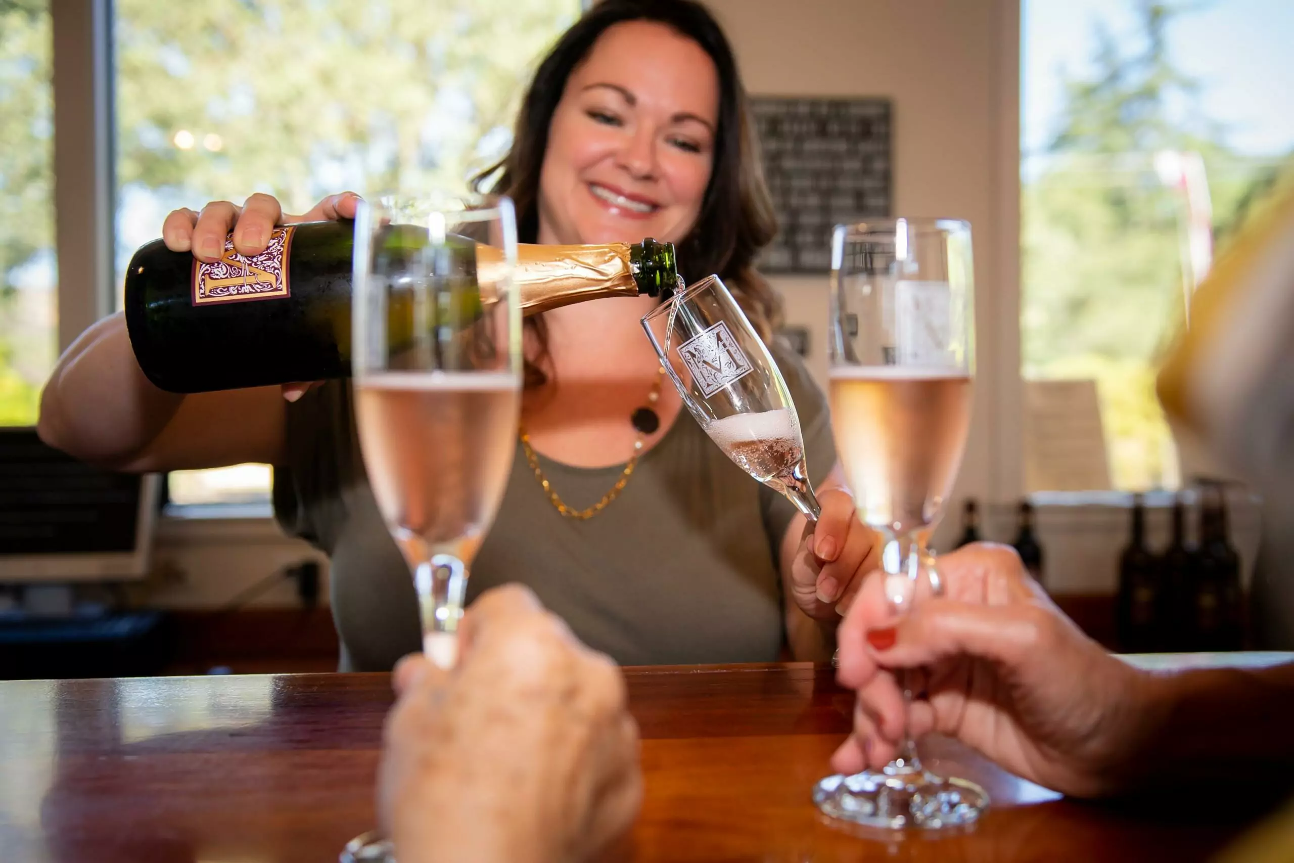 Woman pouring wine into the glass