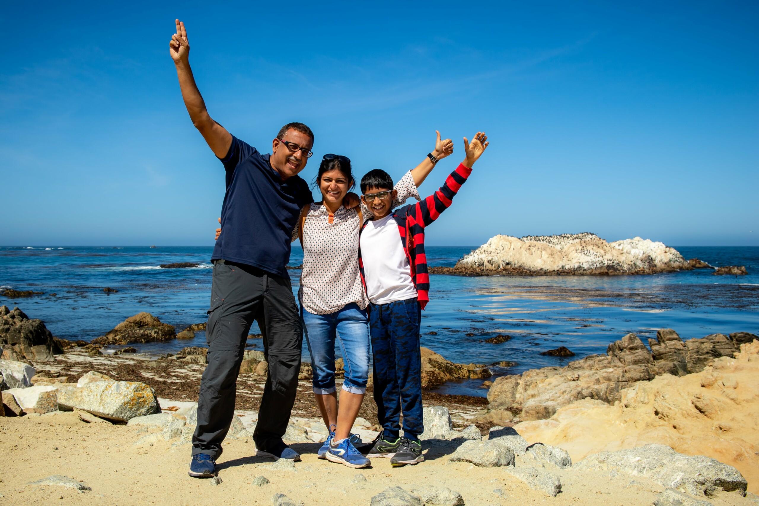 happy family in front of beach in monterey