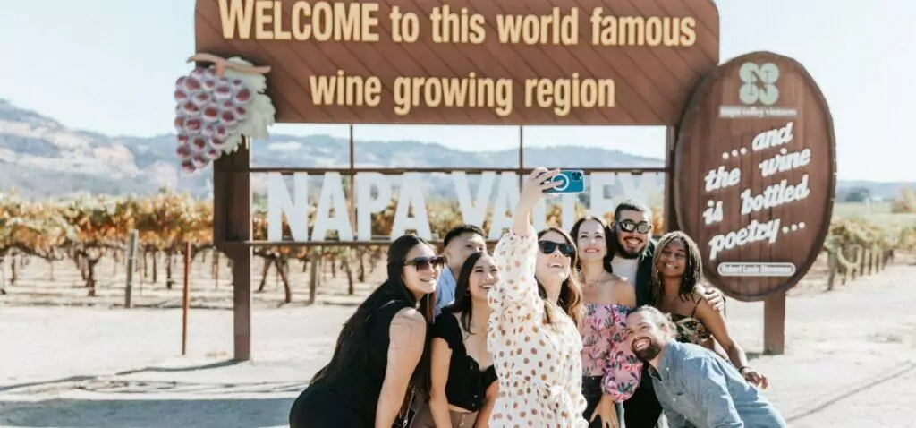 People taking photo in front of Napa Valley sign