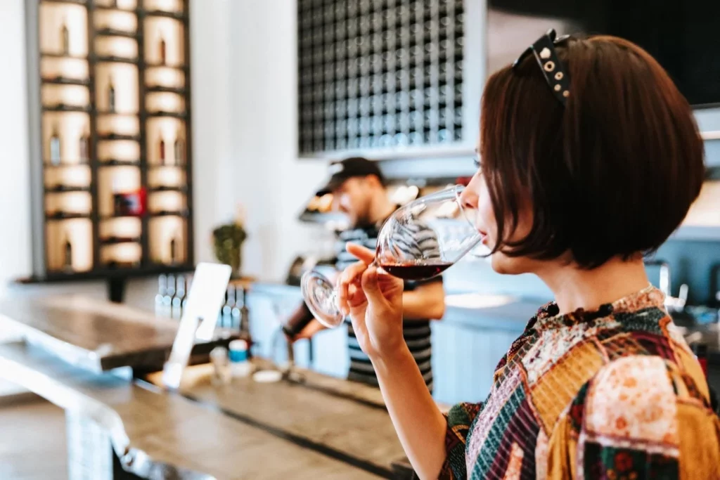 woman tasting red wine