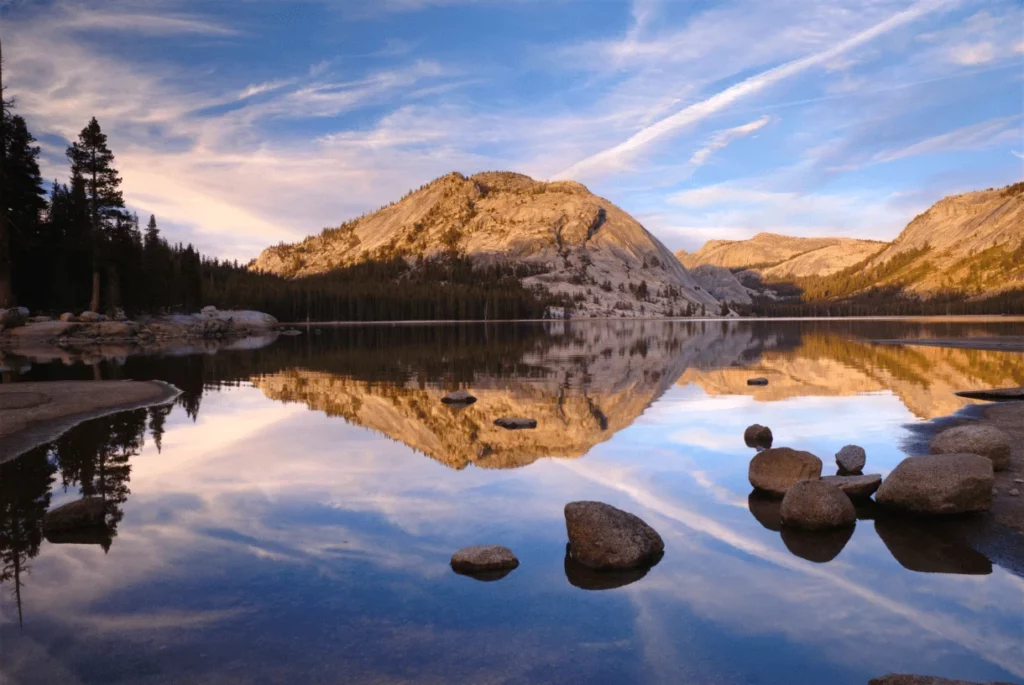 tenaya lake reflecting mountains around it  