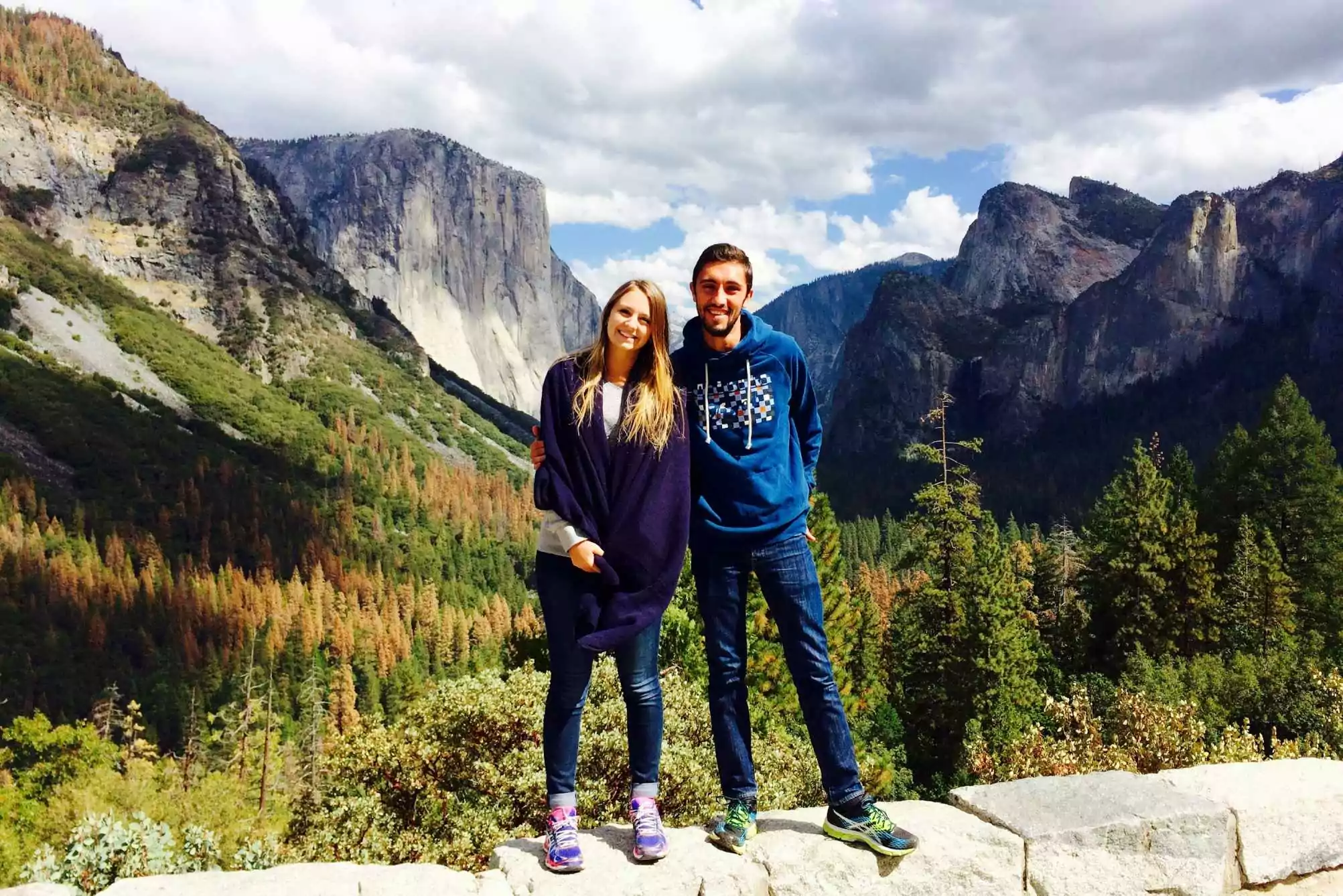 a couple standing at the tunnel view