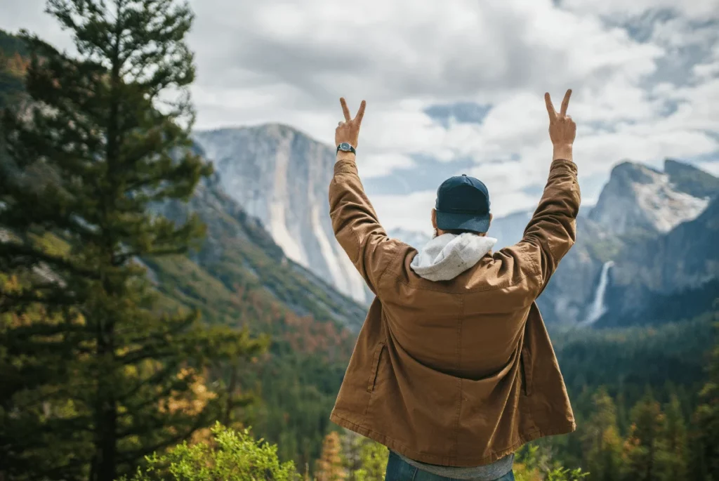 man standing in front of  yosemite valley