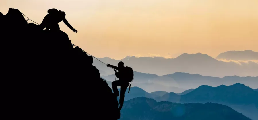 two people rock climbing