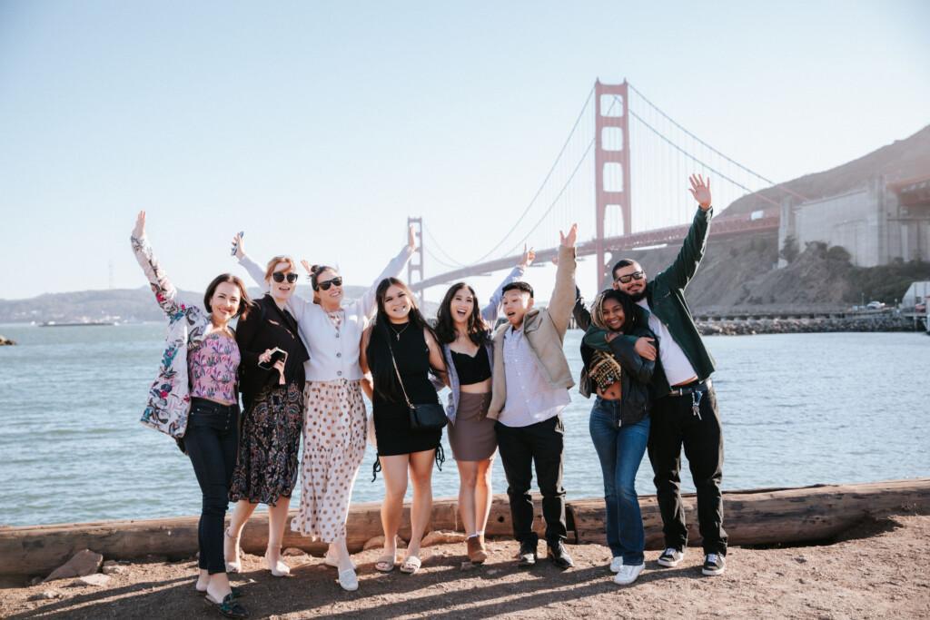 people standing in front of the golden gate bridge during Fall in San Francisco