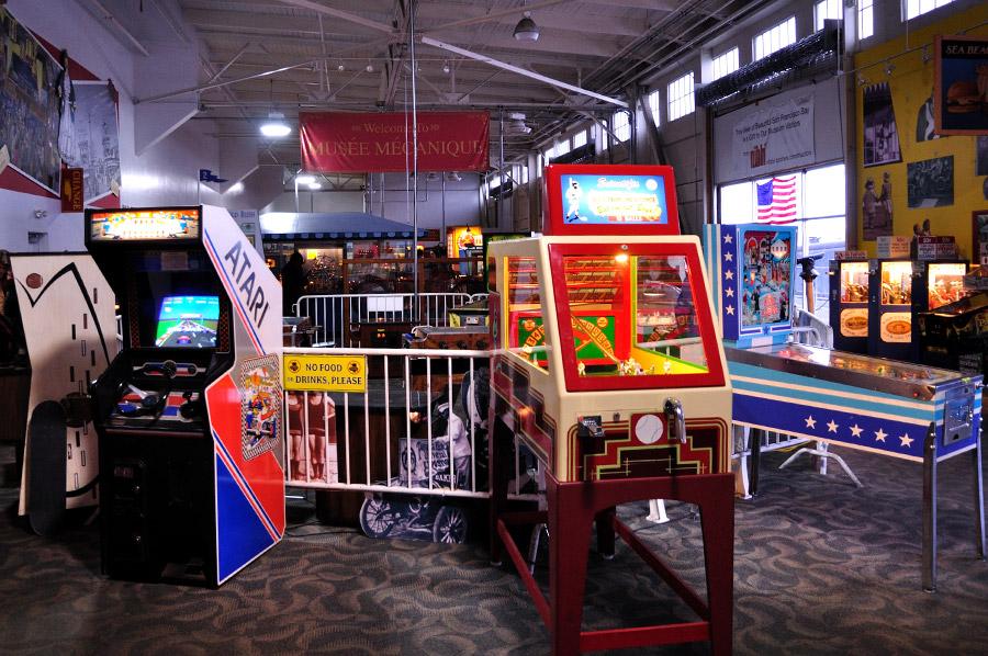 a room filled with different types of video games in musee mecanique