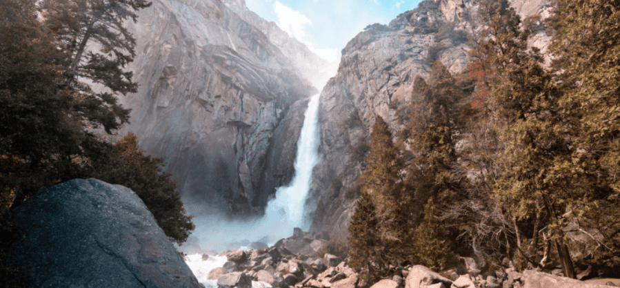 waterfall in between mountains