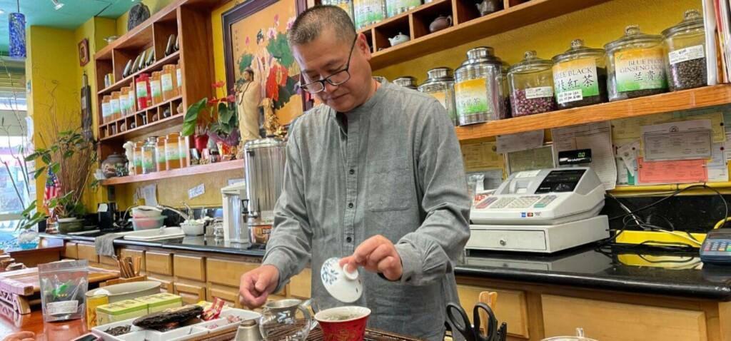 man doing tea at vital tea leaf