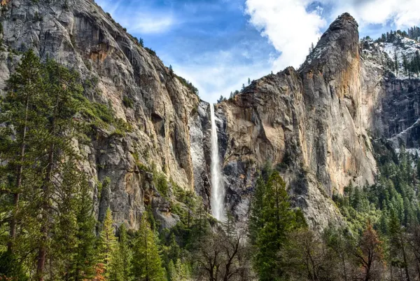 Bridalveil Fall cascading down the mountain, located in Yosemite National Park, California.