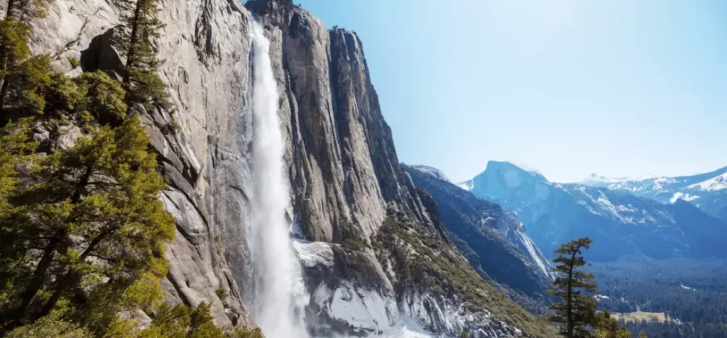 flowing falls between a mountain