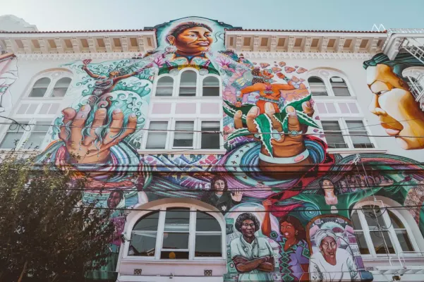 mural of a woman on a budling wall 