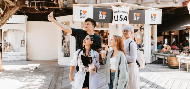 group of people taking photos in fisherman's wharf