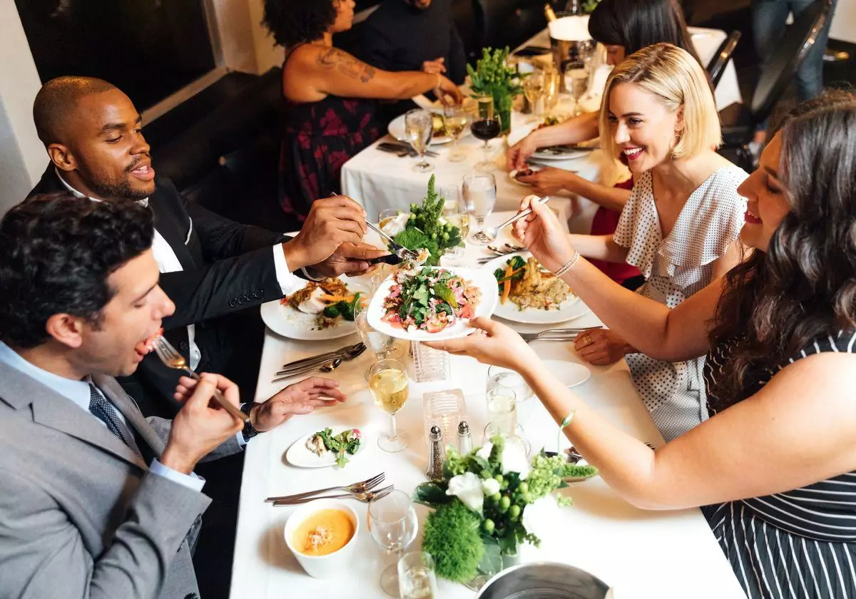 people eating dinner at a table