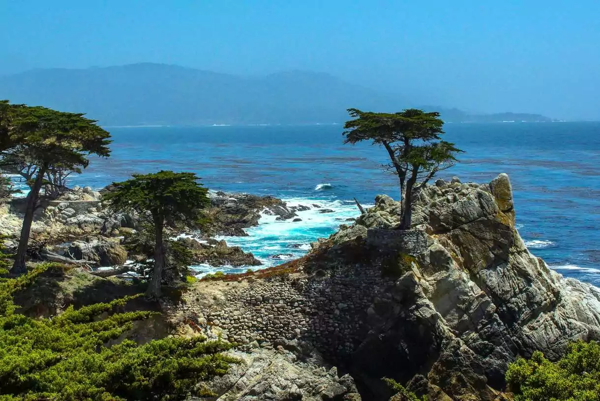 a view of the ocean from a rocky cliff