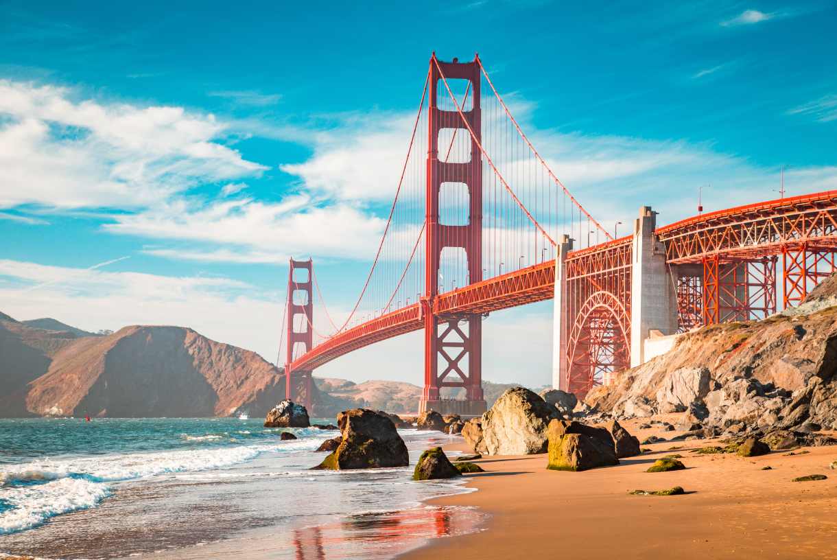 a view of the golden gate bridge from the beach