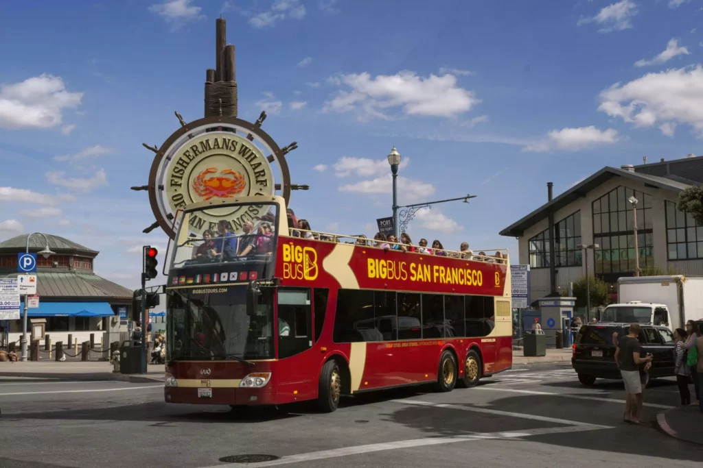 big bus parked in front of fisherman's wharf