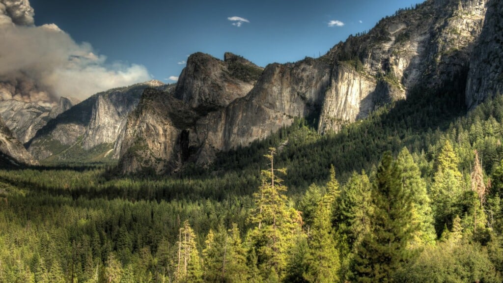 tunnel view with yosemite valley and blue sky in the background