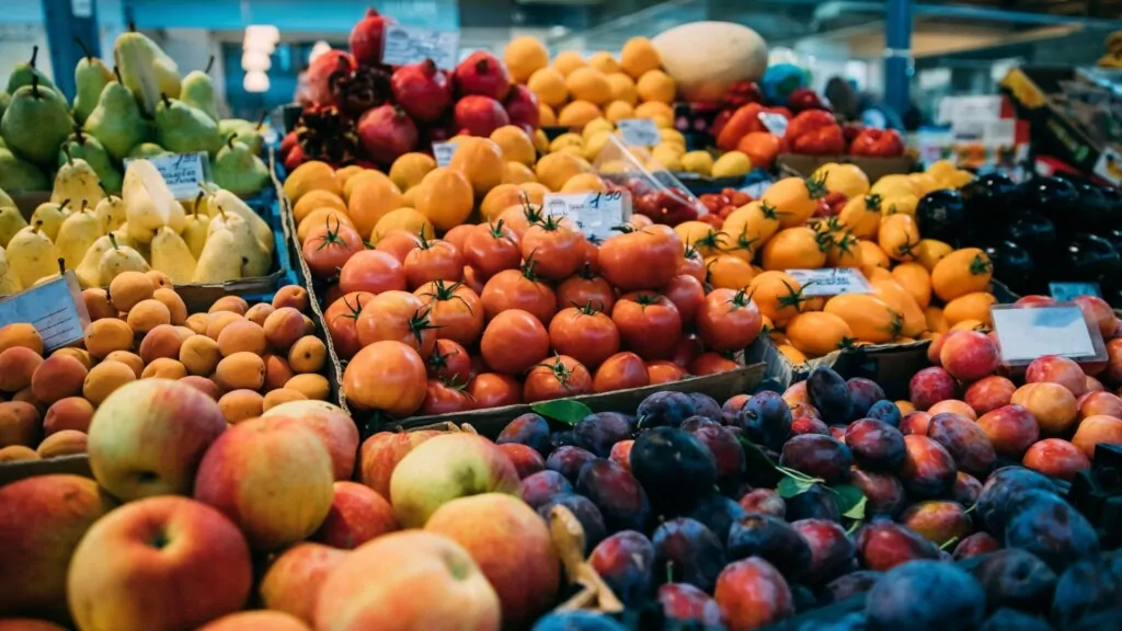 ripe fruits sorted out in baskets in farmer's market 