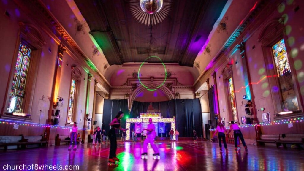 group of people roller skating inside an abandoned building on a rainy day