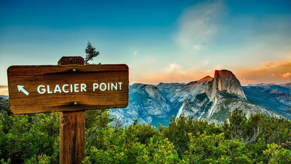 signage of glacier point with a beautiful sunset in the background