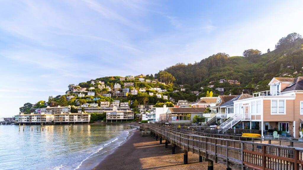 houses on the hill near the water during a day trip from san francisco