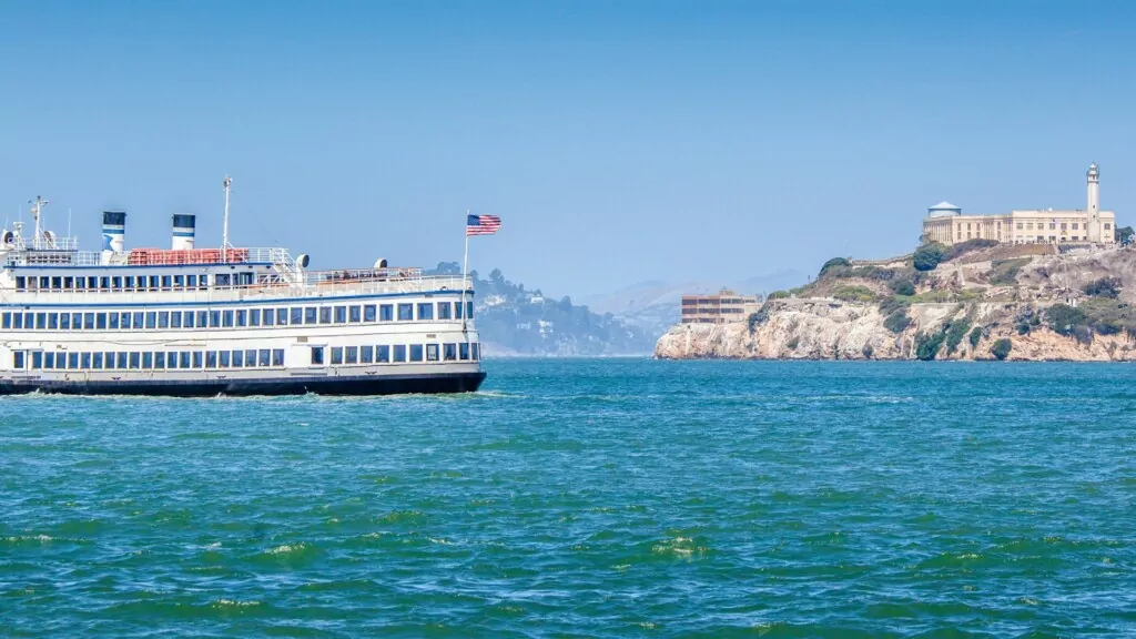 Alcatraz cruises boat on the water with Alcatraz island on the background