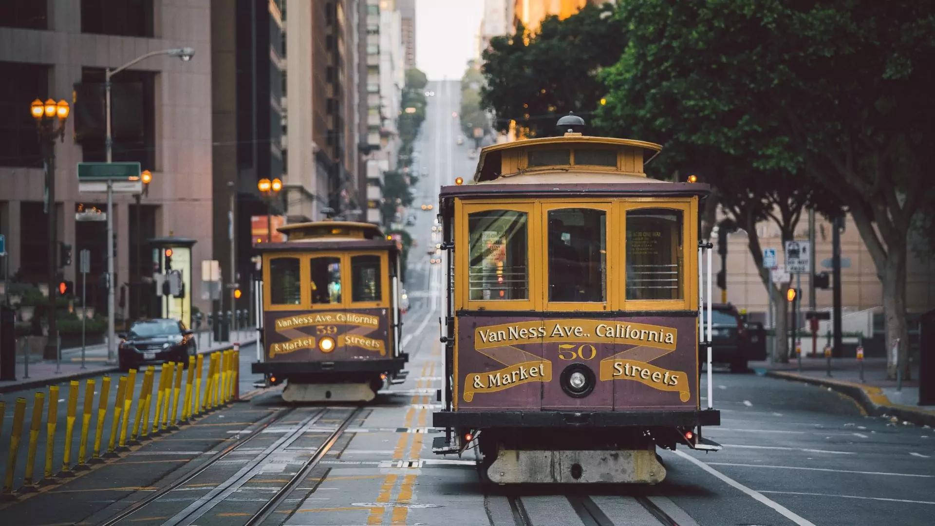 San Francisco cable cars climbing a hill along Van Ness Ave and Market Streets